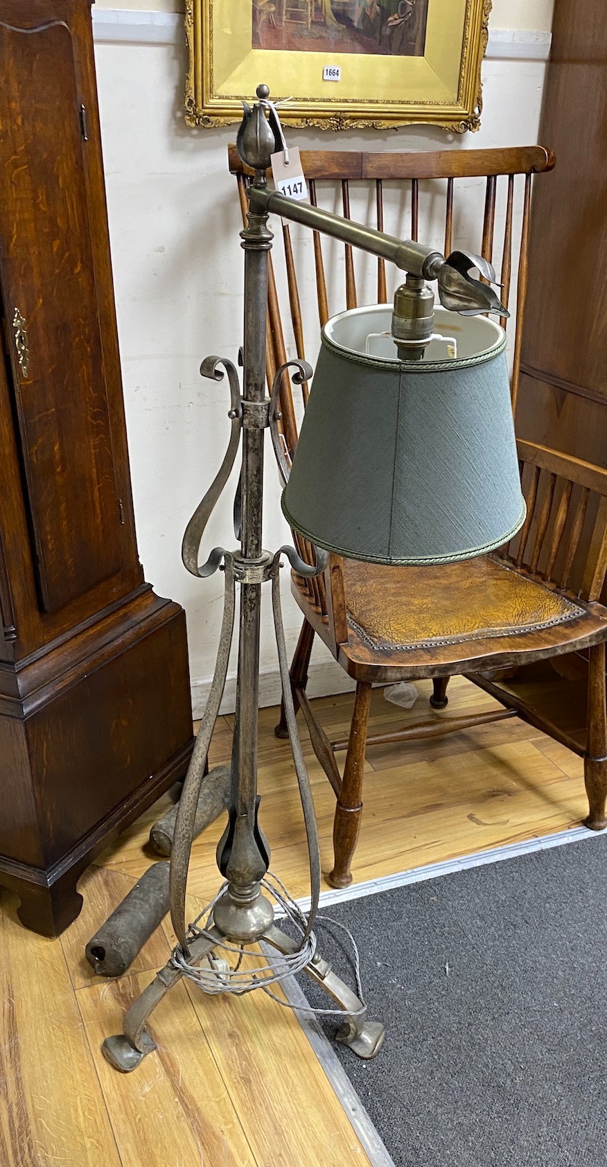An Art Nouveau style wrought iron telescopic lamp standard